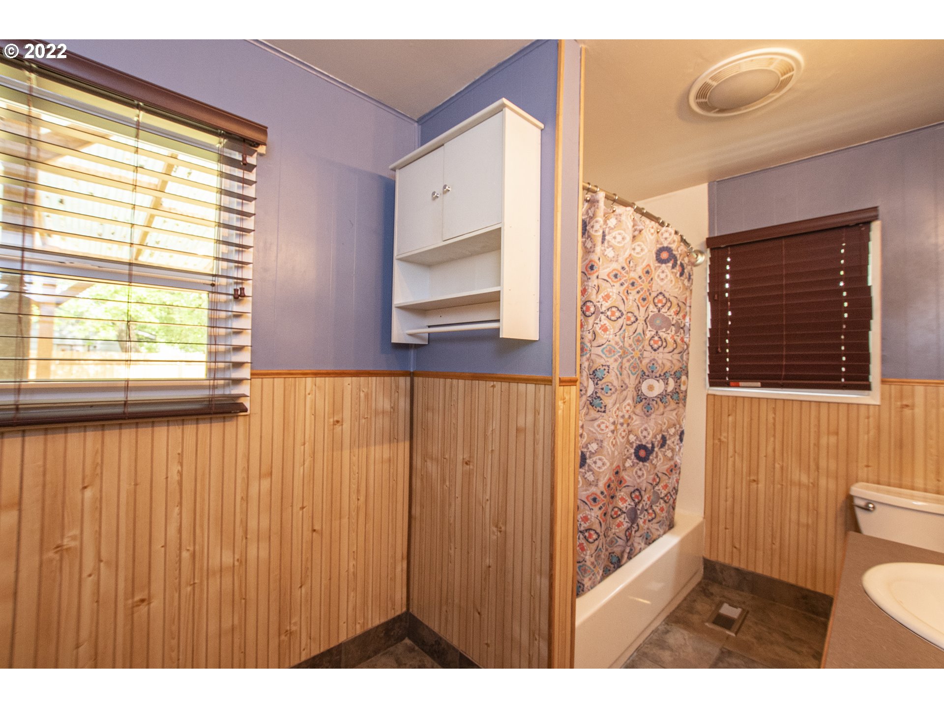 388 South 46th Street Springfield, OR 97478 - Photo 14 of 22 a view of a bathroom with a window and a toilet