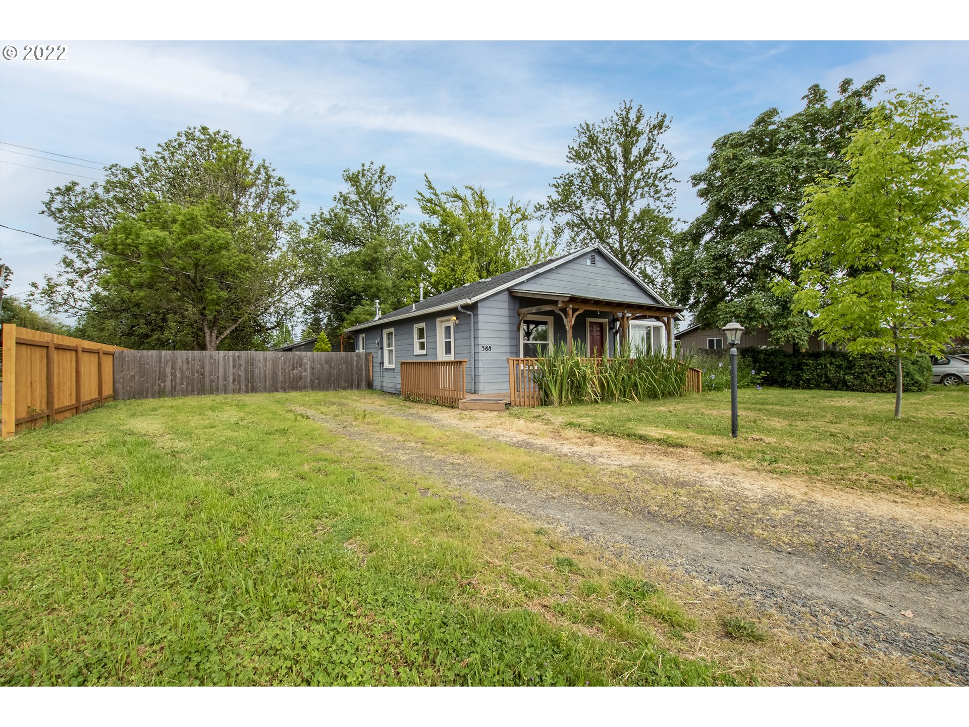 388 South 46th Street Springfield, OR 97478 - Photo 3 of 22 a backyard of a house with table and chairs
