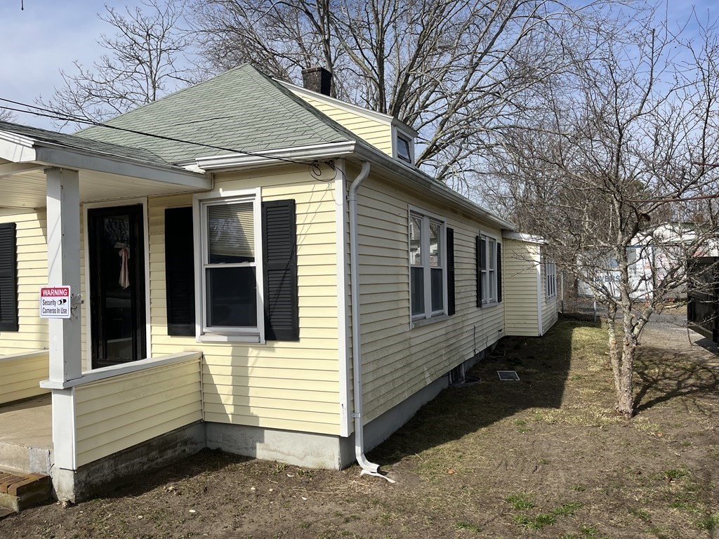 2832 Cranberry Highway Wareham, MA 02571 - Photo 3 of 3 a view of a house with a yard and large tree