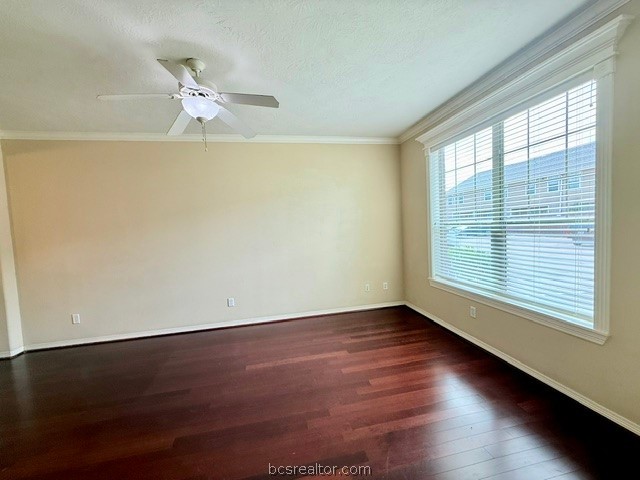 1000 Spring Loop, Unit 1806 College Station, TX 77840 - Photo 3 of 33 Spacious room featuring rich wood-finish flooring, a contemporary ceiling fan with integrated lighting, expansive window with blinds, and detailed crown molding