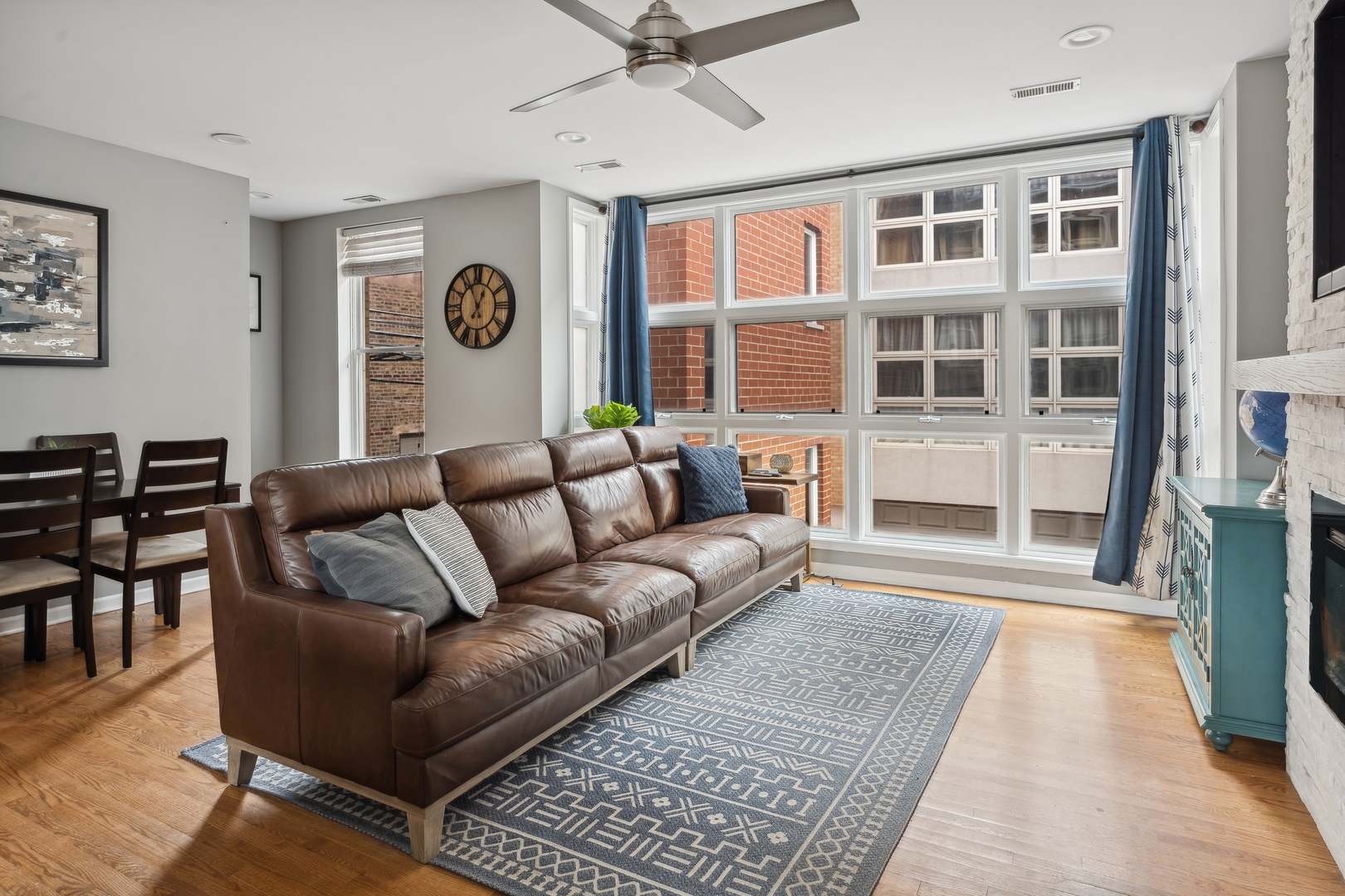 3337 West Irving Park Road, Unit 5 Chicago, IL 60618 - Photo 3 of 20 a living room with furniture and a large window