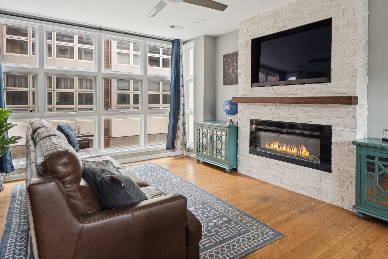3337 West Irving Park Road, Unit 5 Chicago, IL 60618 - Photo 4 of 20 a living room with furniture and a fireplace
