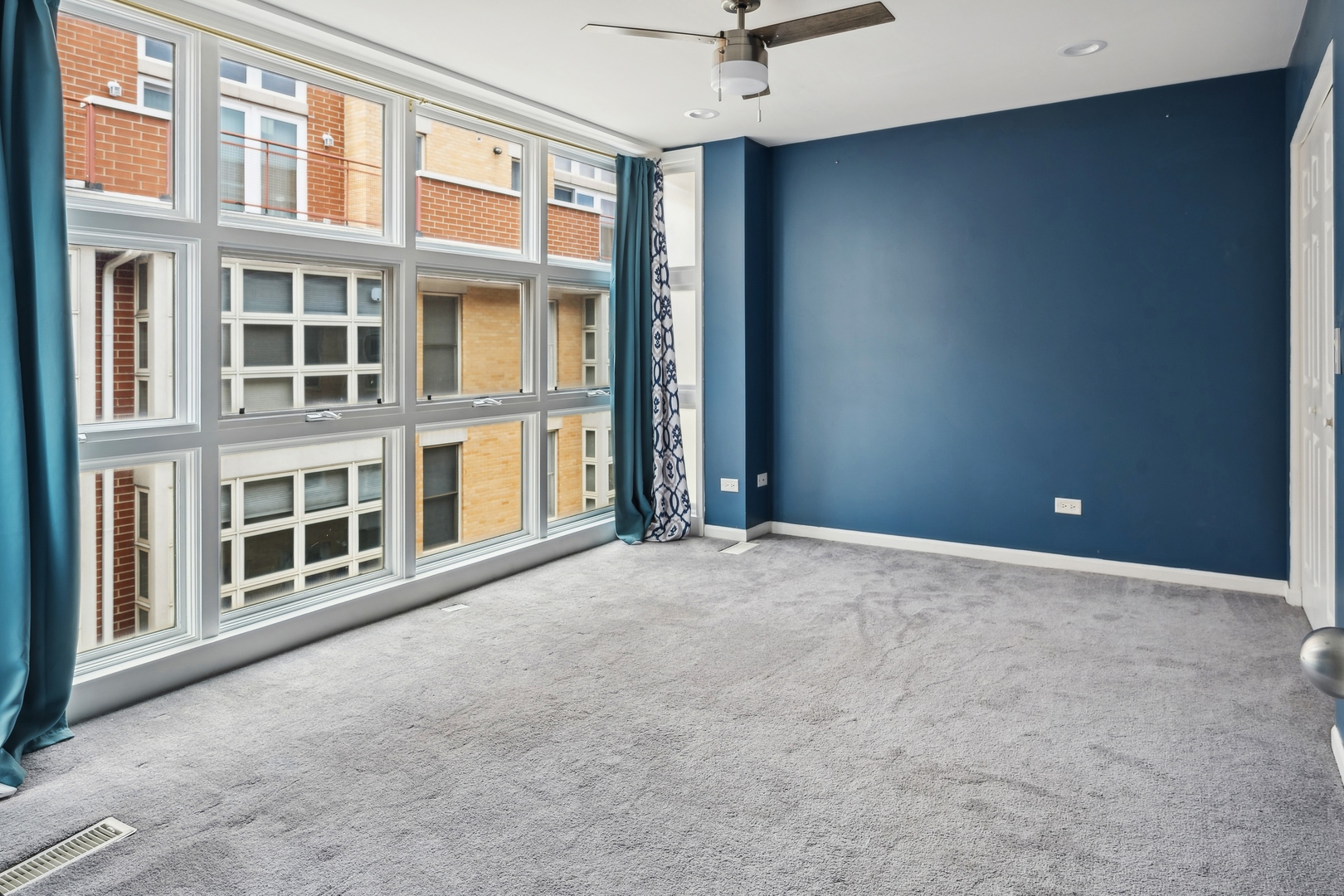 3337 West Irving Park Road, Unit 5 Chicago, IL 60618 - Photo 9 of 20 a view of an empty room with a window