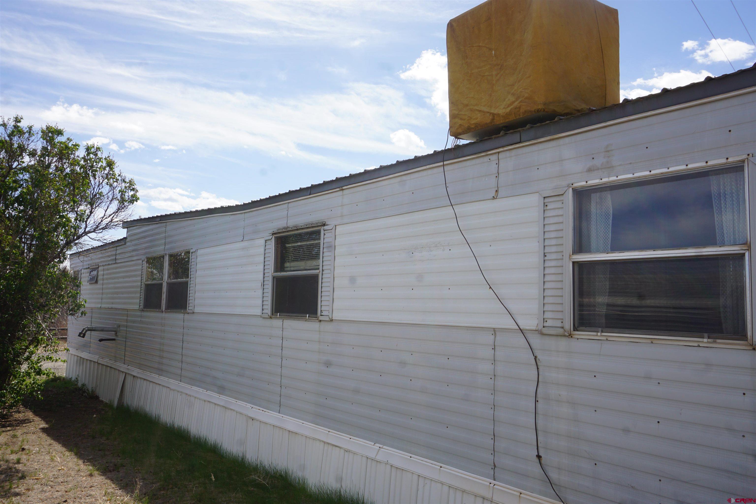 60497 Maple Grove Road Montrose, CO 81403 - Photo 3 of 16 a backyard of a house