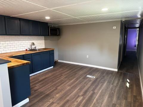 293 Festival Road Washington, PA 15301 - Photo 2 of 10 a kitchen with wooden cabinets and a sink