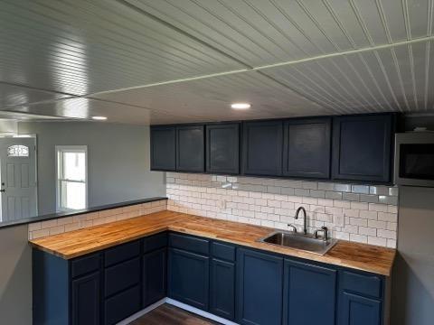 293 Festival Road Washington, PA 15301 - Photo 5 of 10 a kitchen with a sink and cabinets