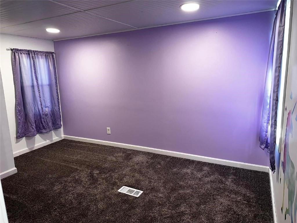 293 Festival Road Washington, PA 15301 - Photo 9 of 10 an empty room with wooden floor and windows