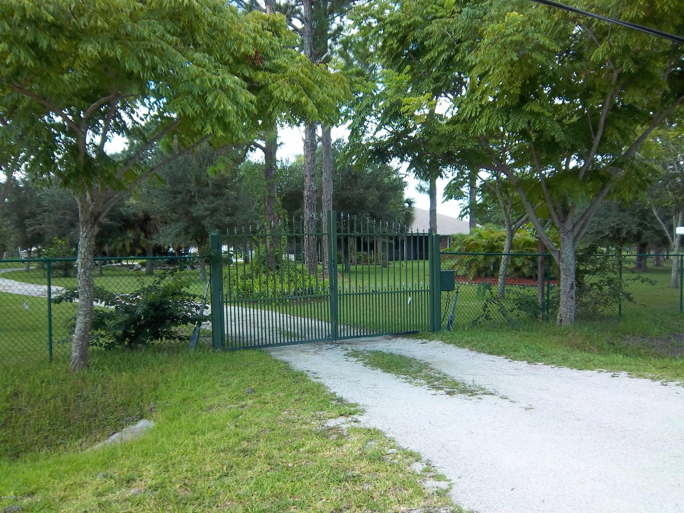 3695 Grant Road Grant Valkaria, FL 32949 - Photo 1 of 44 Gated Entrance