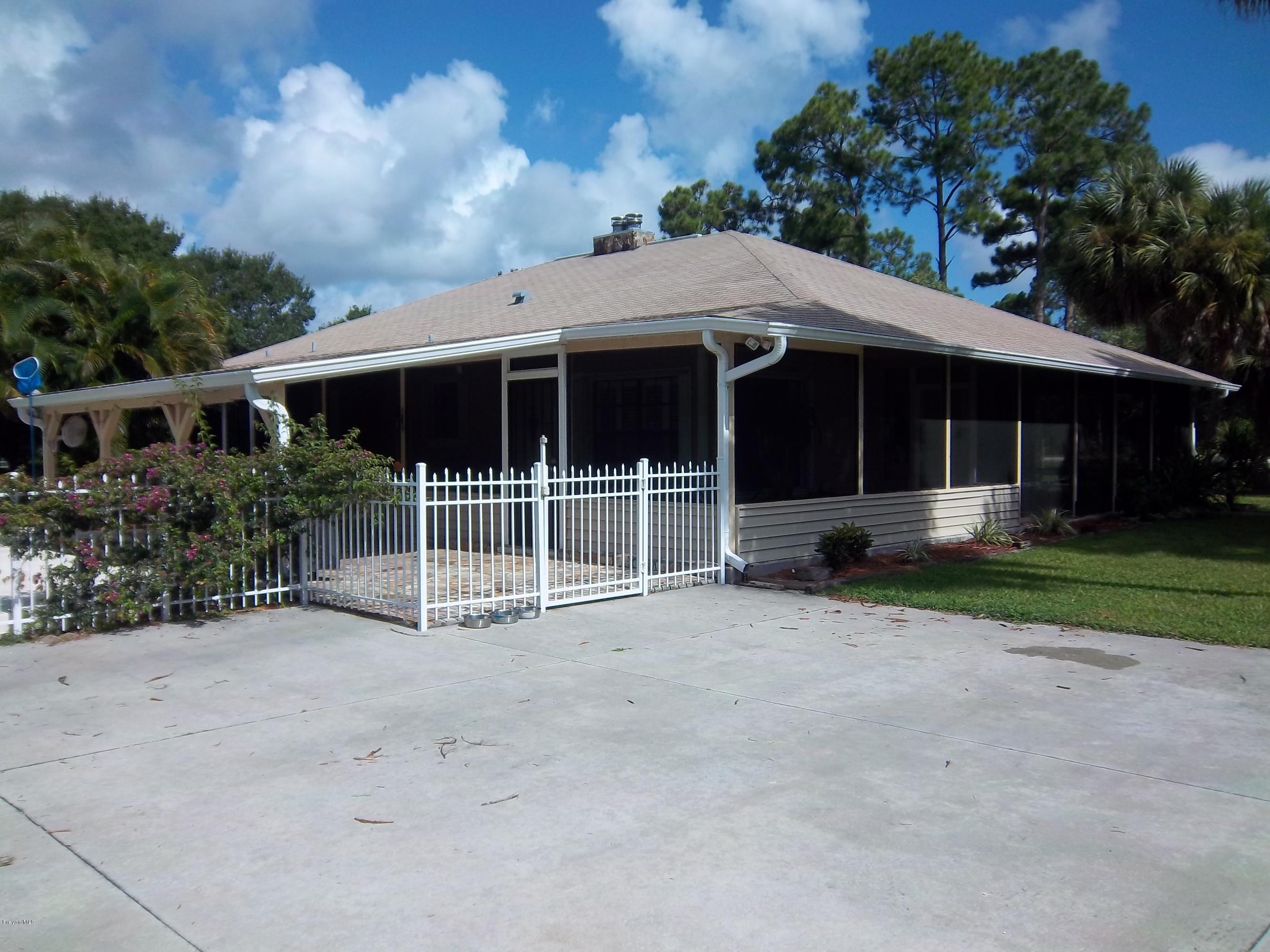 3695 Grant Road Grant Valkaria, FL 32949 - Photo 3 of 44 Rear of Home