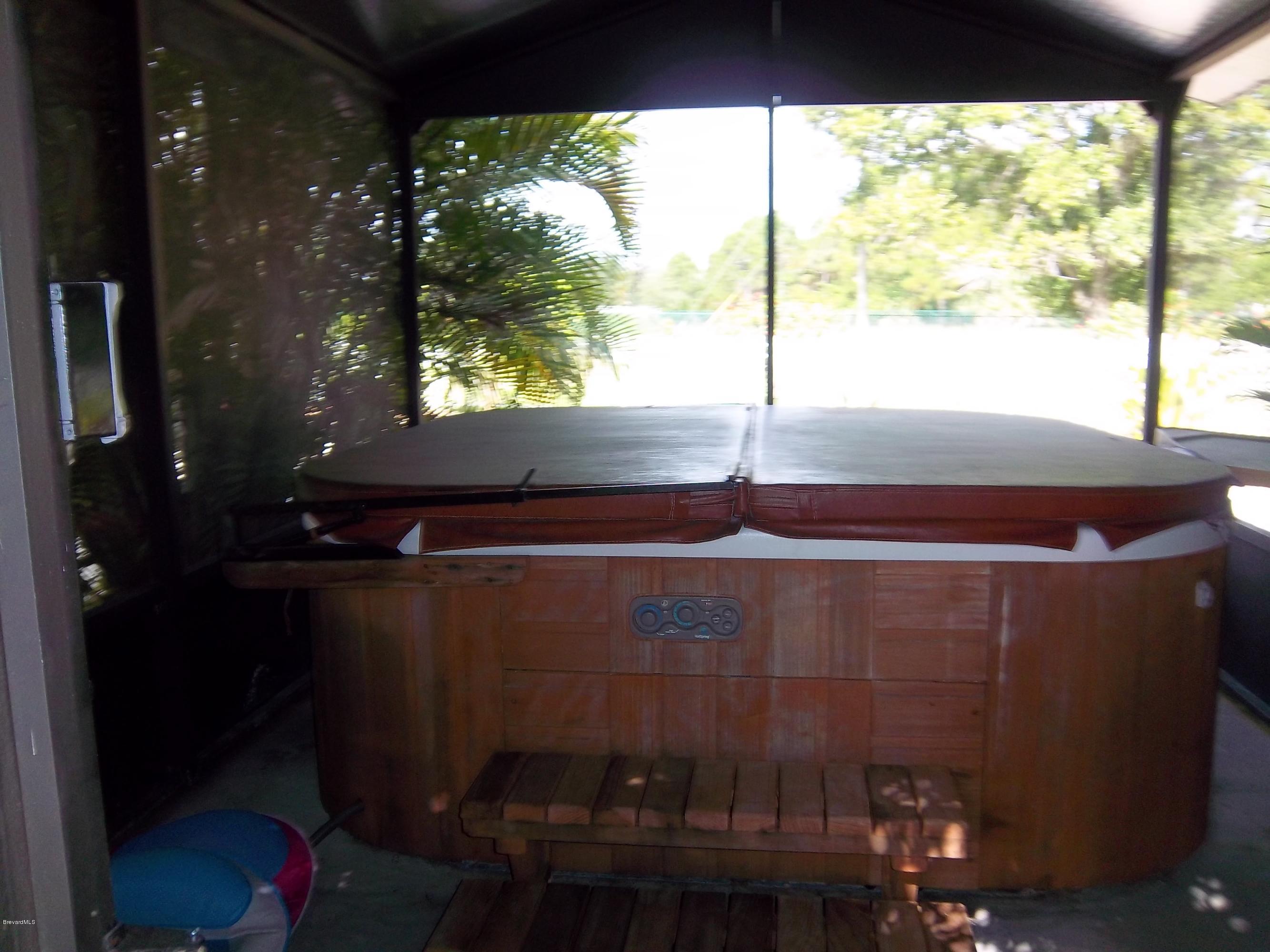 3695 Grant Road Grant Valkaria, FL 32949 - Photo 26 of 44 Screened Hot Tub