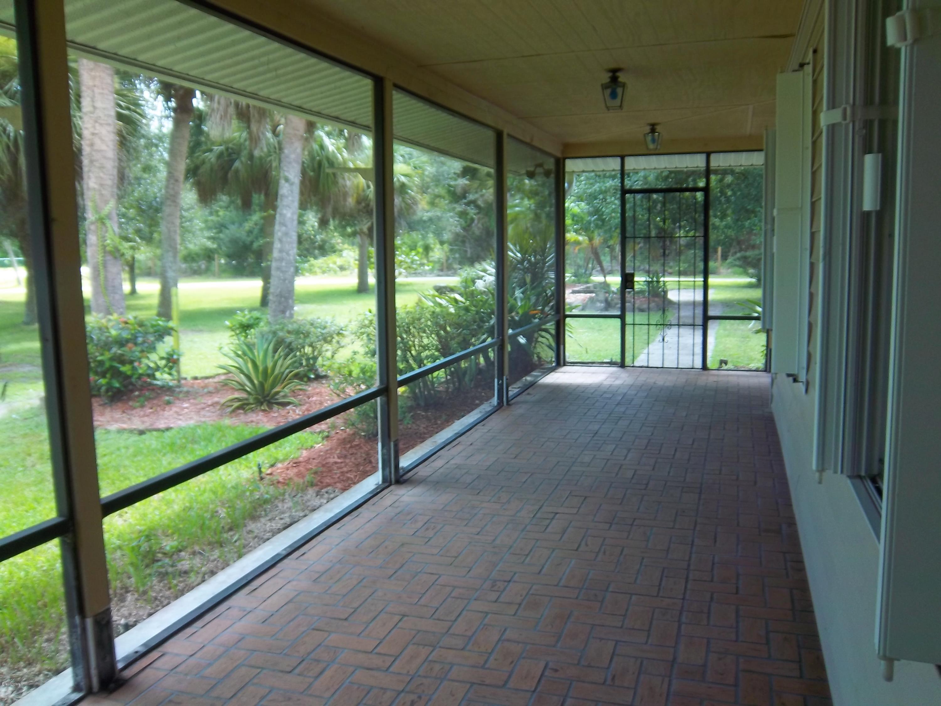 3695 Grant Road Grant Valkaria, FL 32949 - Photo 43 of 44 Wrap Around Porches
