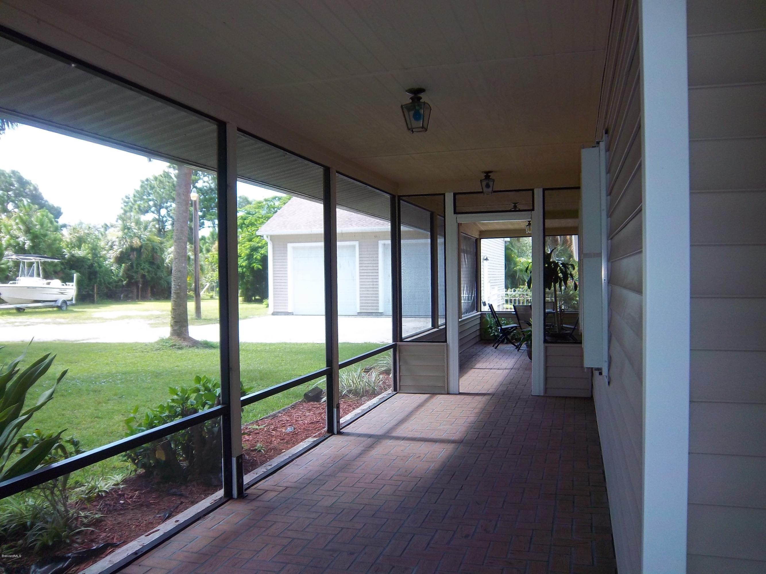 3695 Grant Road Grant Valkaria, FL 32949 - Photo 44 of 44 Wrap Around Porch East Side