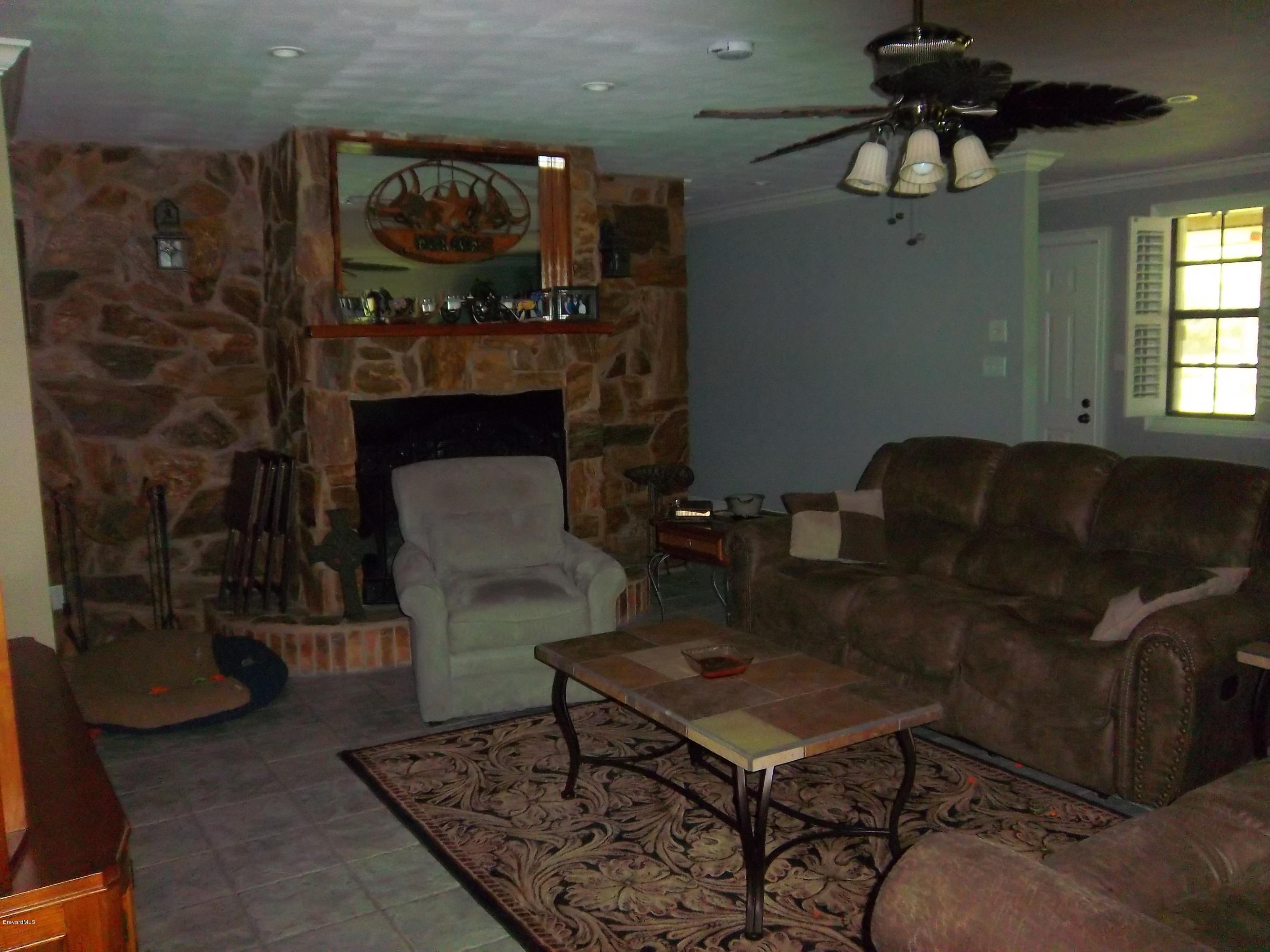 3695 Grant Road Grant Valkaria, FL 32949 - Photo 8 of 44 Living Room w/ Fire Place
