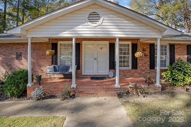 front view of a house with potted plants