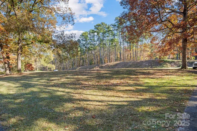 a view of outdoor space with swimming pool and trees