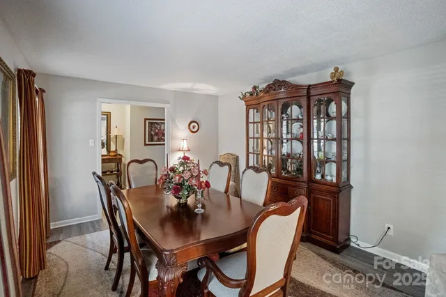 a view of a dining room with furniture and window