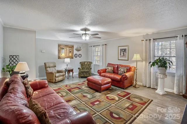 a living room with furniture rug and window