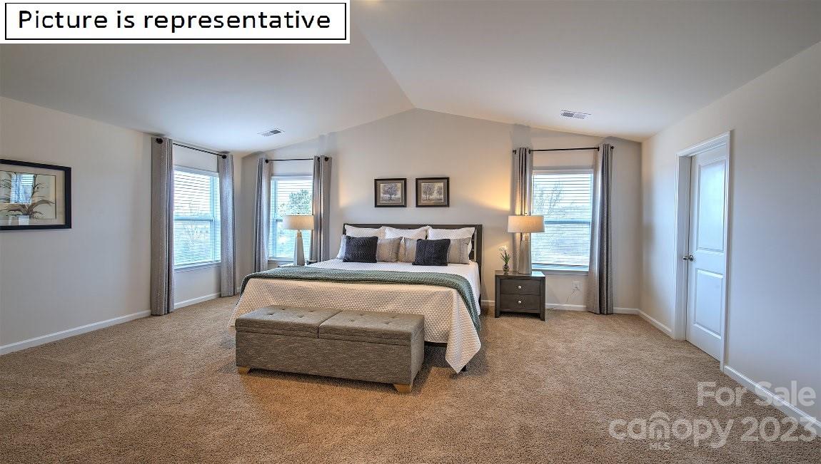 2164 Vanderlyn Street Monroe, NC 28112 - Photo 26 of 37 a spacious bedroom with a bed and a window