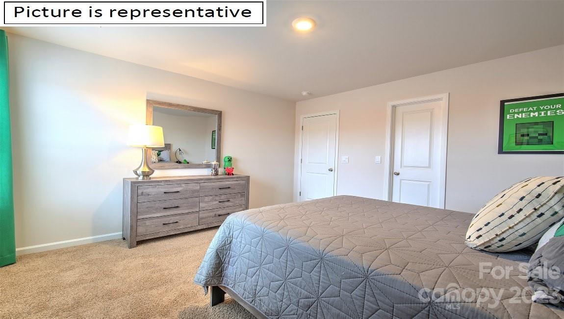 2164 Vanderlyn Street Monroe, NC 28112 - Photo 32 of 37 a bedroom with a bed and a dresser