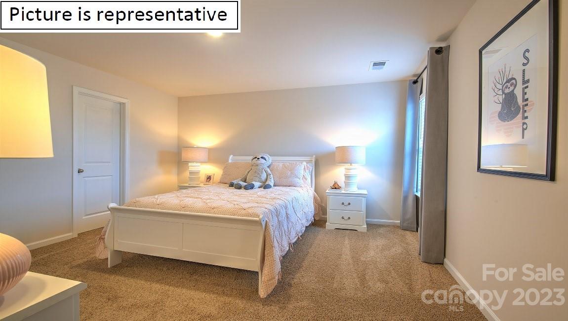 2164 Vanderlyn Street Monroe, NC 28112 - Photo 34 of 37 a spacious bedroom with a bed and window