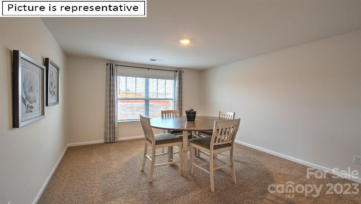 2164 Vanderlyn Street Monroe, NC 28112 - Photo 37 of 37 a view of a dining room with furniture and window