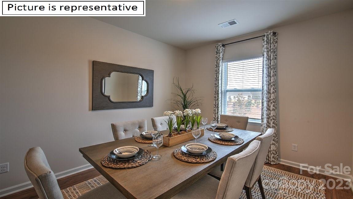 2164 Vanderlyn Street Monroe, NC 28112 - Photo 6 of 37 a dining room with furniture and a window