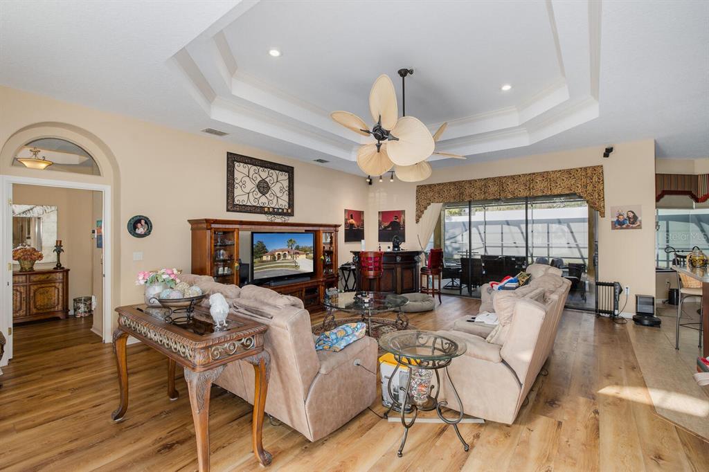 427 Archway Drive Spring Hill, FL 34608 - Photo 18 of 68 a living room with fireplace furniture and a large window