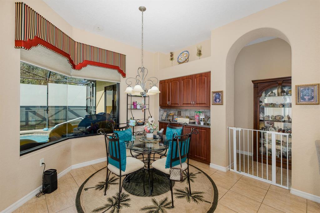 427 Archway Drive Spring Hill, FL 34608 - Photo 27 of 68 a very nice looking room with a large window and furniture
