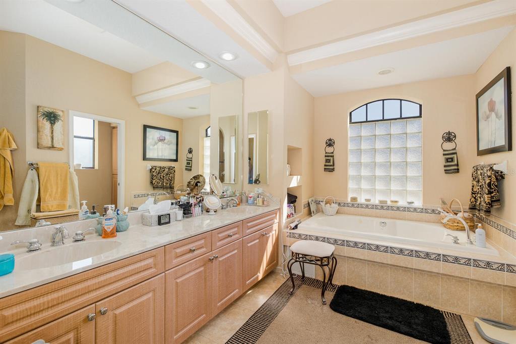 427 Archway Drive Spring Hill, FL 34608 - Photo 32 of 68 a spacious bathroom with double vanity and a bathtub