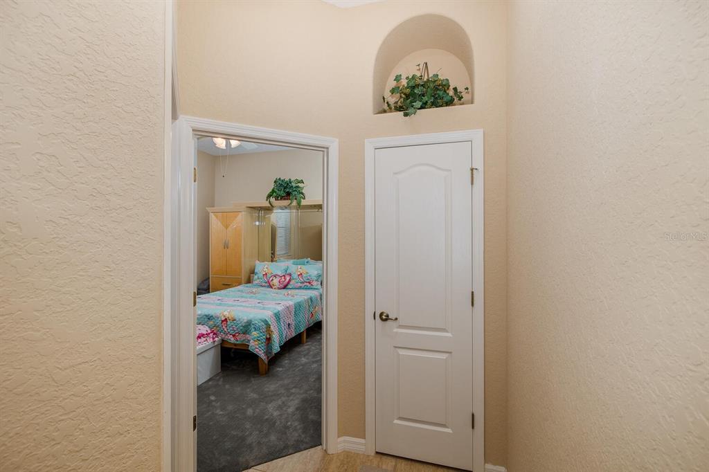 427 Archway Drive Spring Hill, FL 34608 - Photo 36 of 68 a room that has a bed and a dresser in it