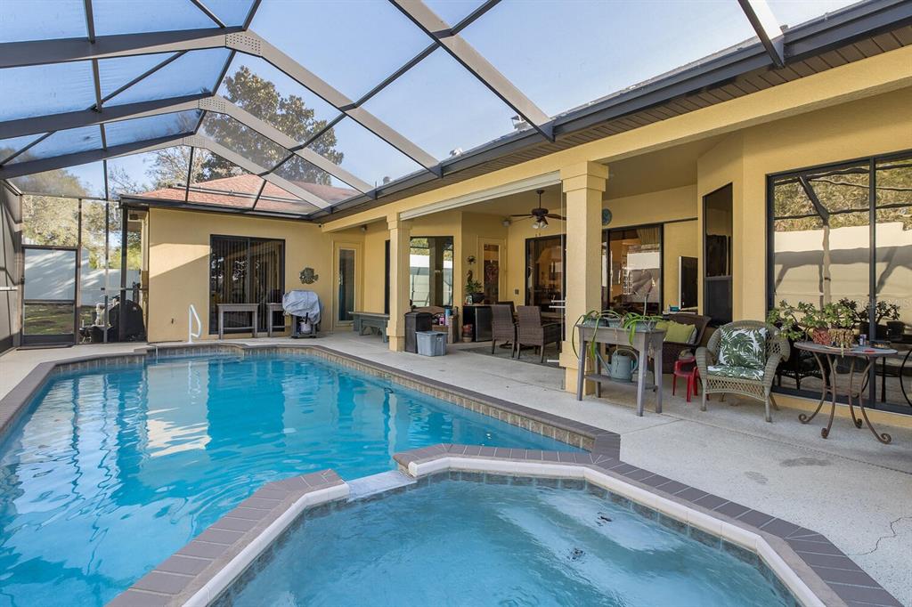 427 Archway Drive Spring Hill, FL 34608 - Photo 56 of 68 a view of a living room and chandelier