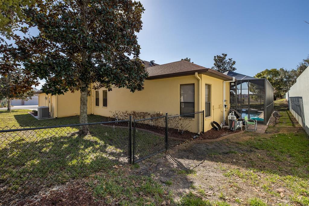 427 Archway Drive Spring Hill, FL 34608 - Photo 59 of 68 a view of a house with a yard