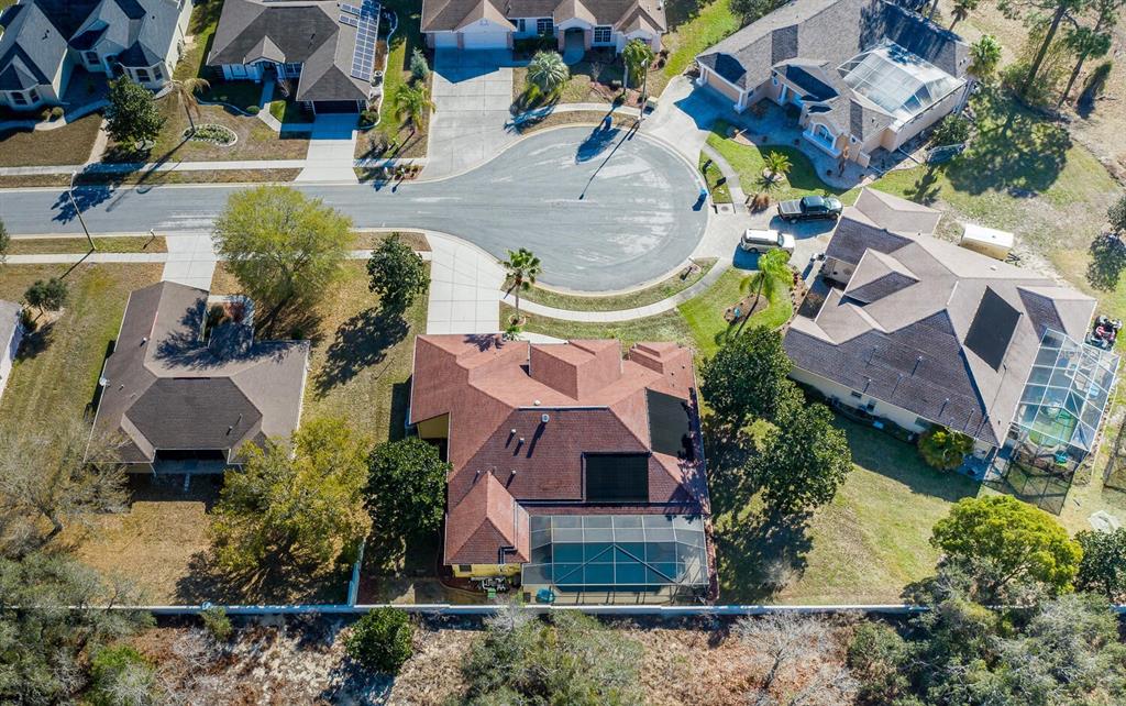 427 Archway Drive Spring Hill, FL 34608 - Photo 61 of 68 an aerial view of a house with a swimming pool