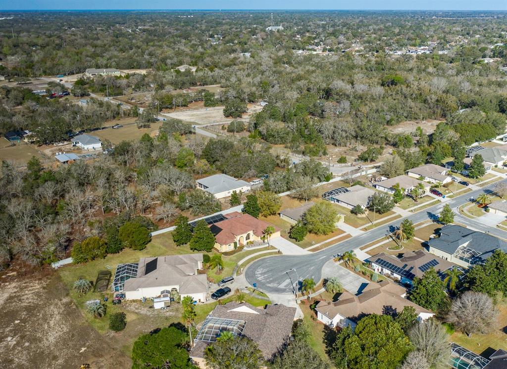 427 Archway Drive Spring Hill, FL 34608 - Photo 65 of 68 an aerial view of residential houses with outdoor space