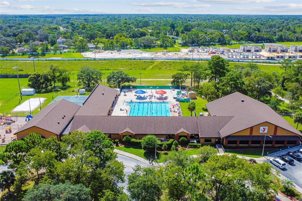 427 Archway Drive Spring Hill, FL 34608 - Photo 67 of 68 an aerial view of a house with a garden and lake view