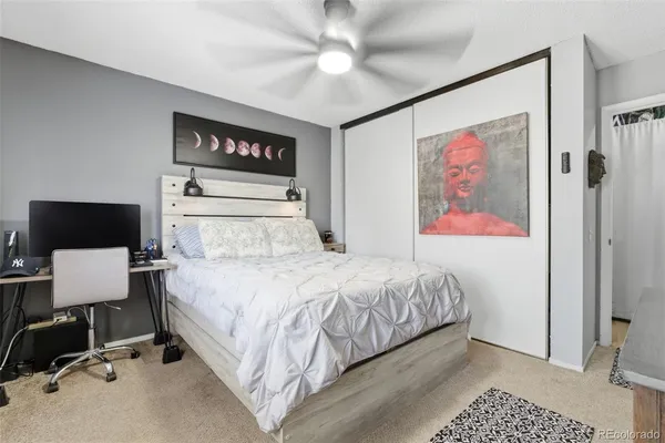a bedroom with a bed and a view of bathroom