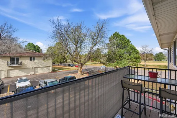 a view of a street from a balcony