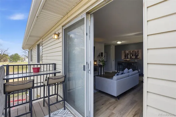 a view of a balcony and furniture