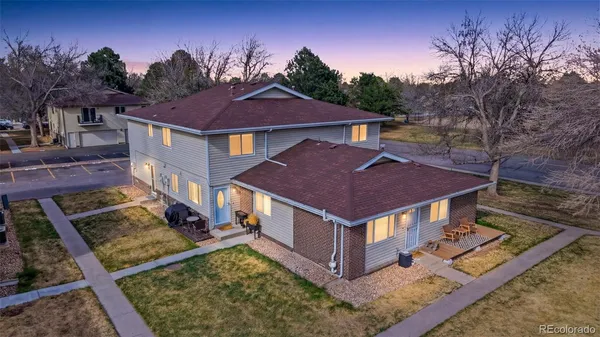 a aerial view of a house with a yard