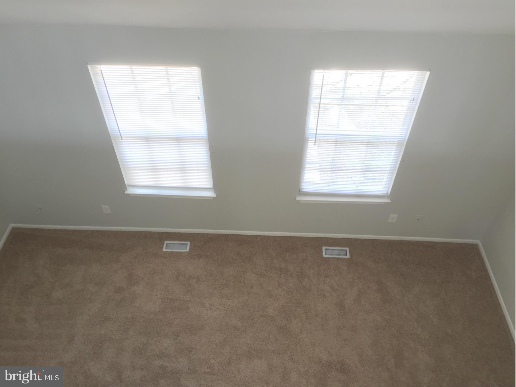 6965 Rockfield Road Baltimore, MD 21244 - Photo 6 of 18 an empty room with a window