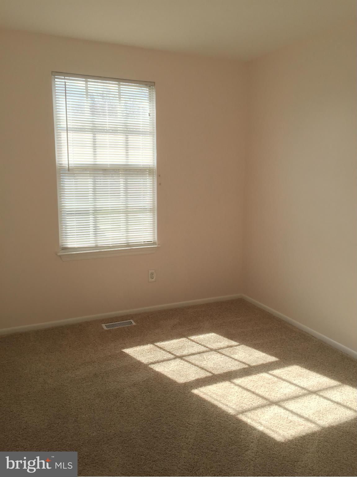 6965 Rockfield Road Baltimore, MD 21244 - Photo 8 of 18 an empty room with a window