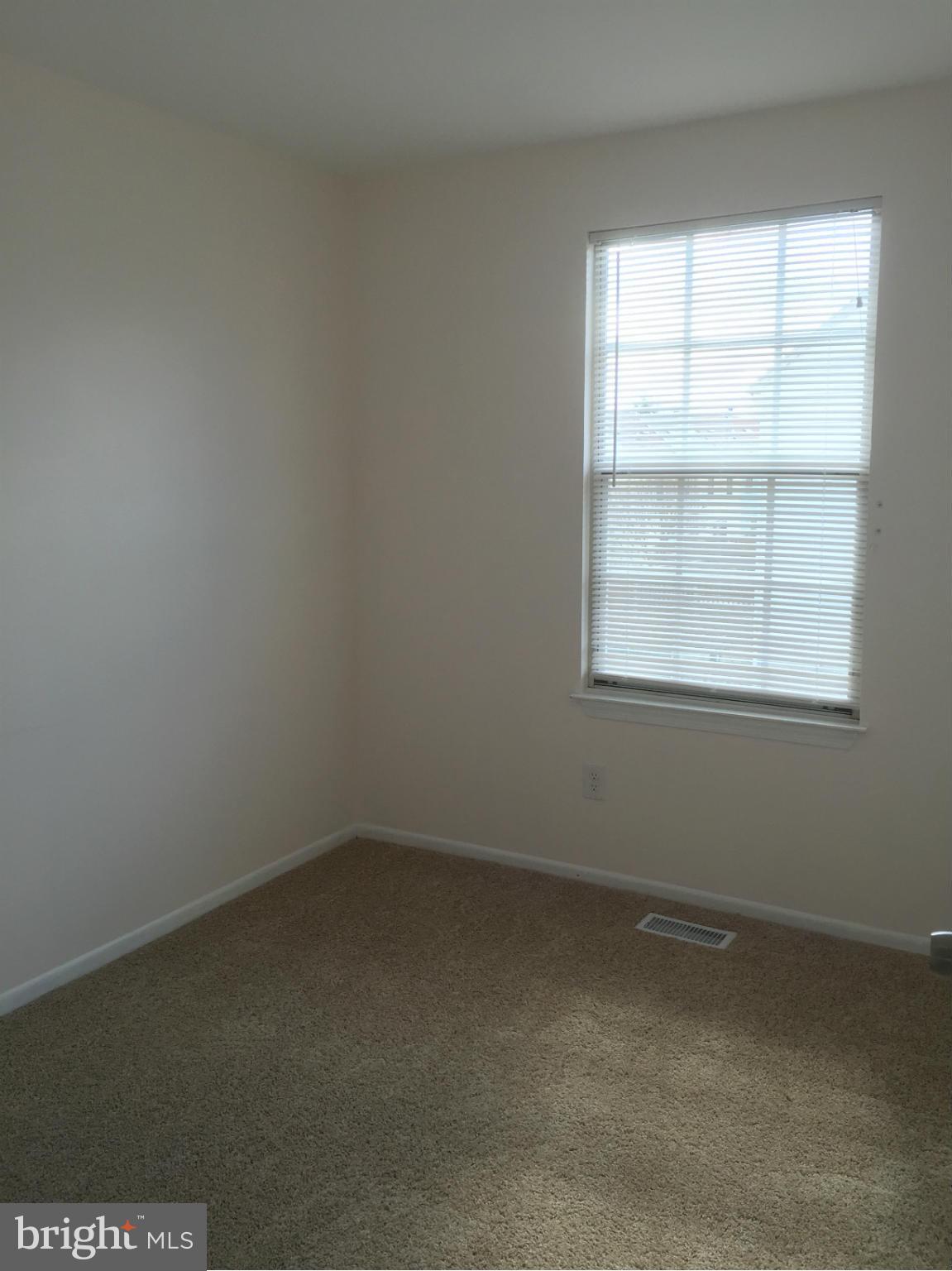 6965 Rockfield Road Baltimore, MD 21244 - Photo 9 of 18 an empty room with a window