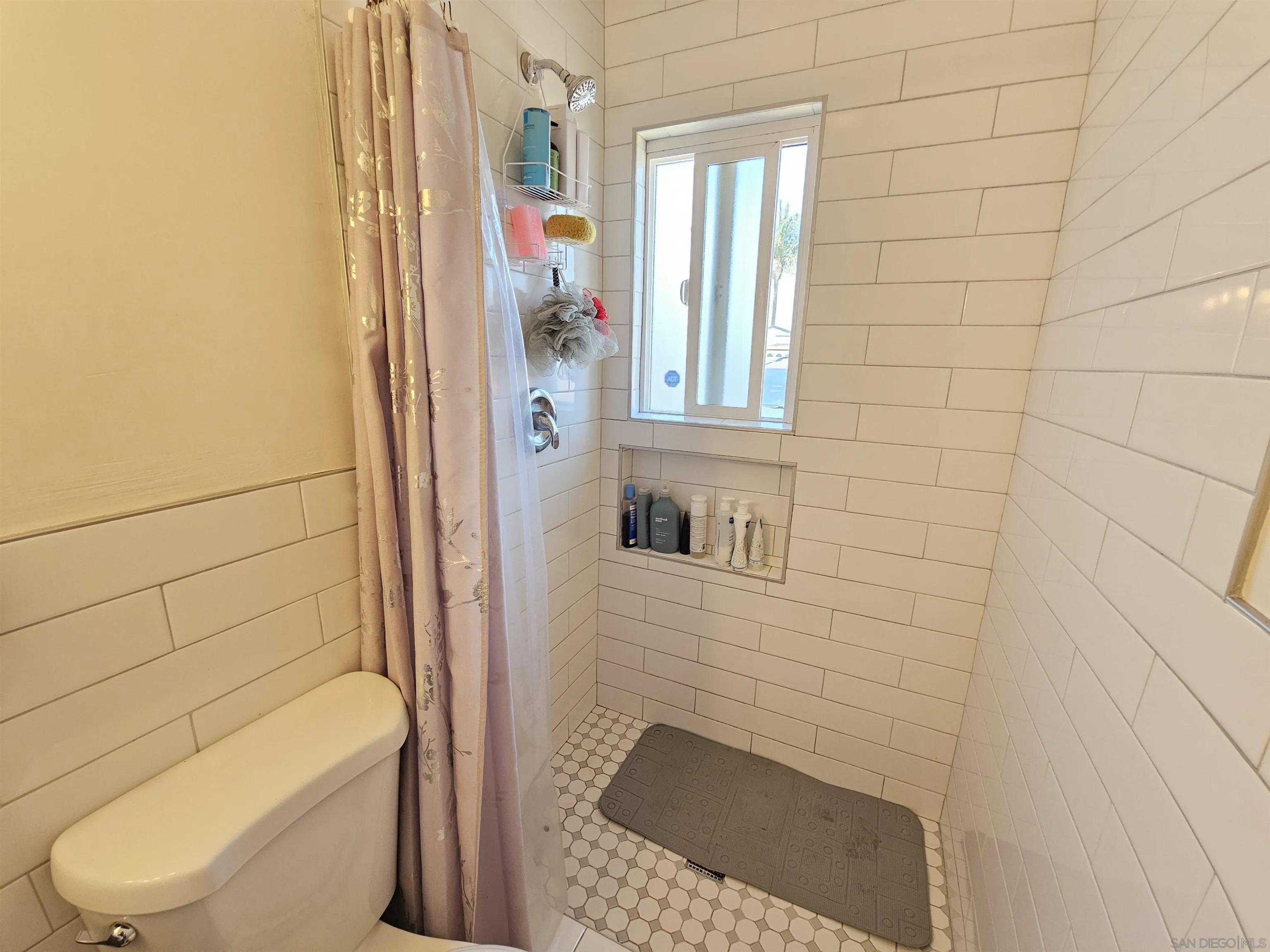 1621 Jade Avenue Chula Vista, CA 91911 - Photo 11 of 19 a bathroom with a shower and toilet