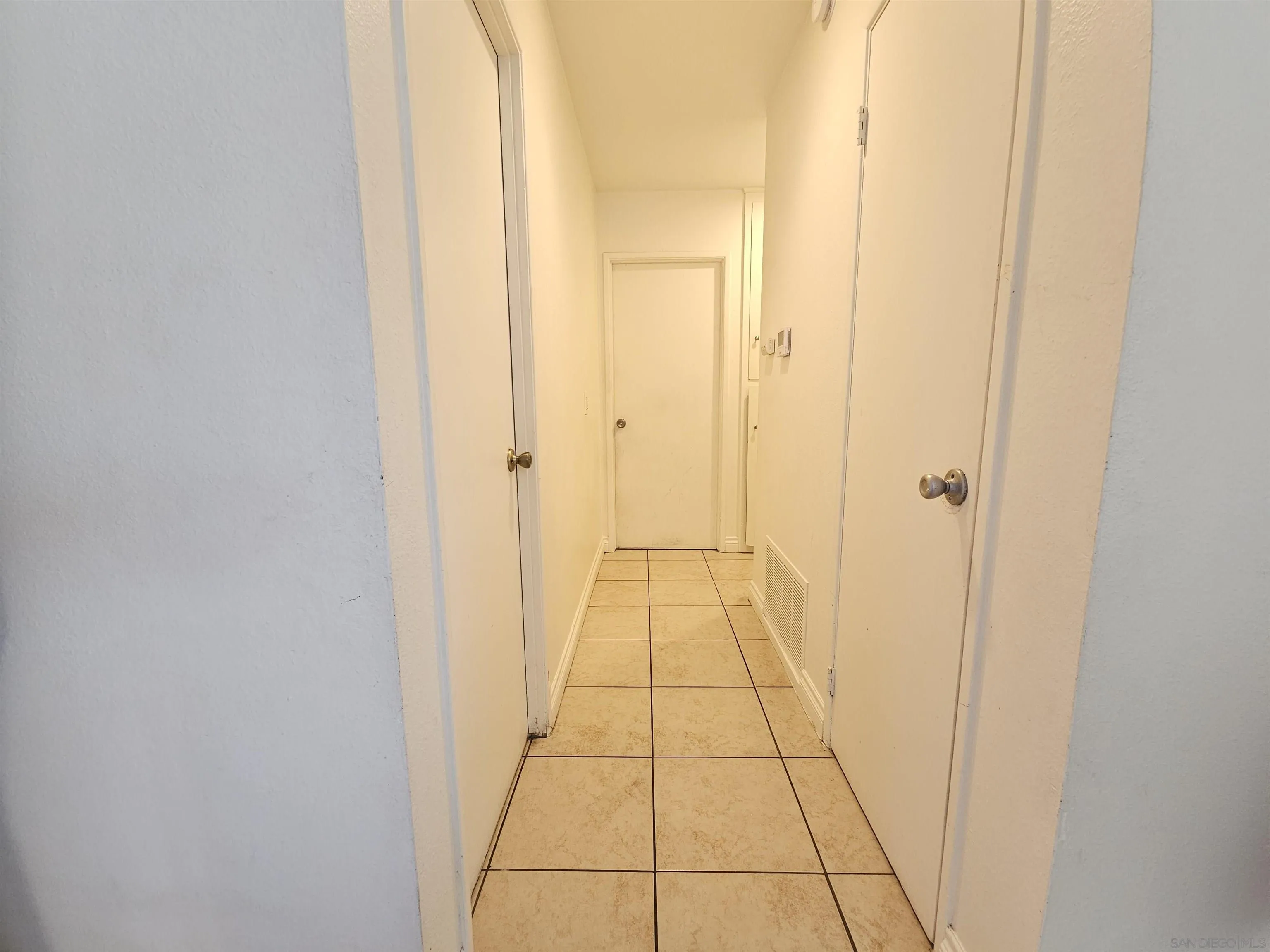 1621 Jade Avenue Chula Vista, CA 91911 - Photo 12 of 19 a view of a bathroom from a hallway