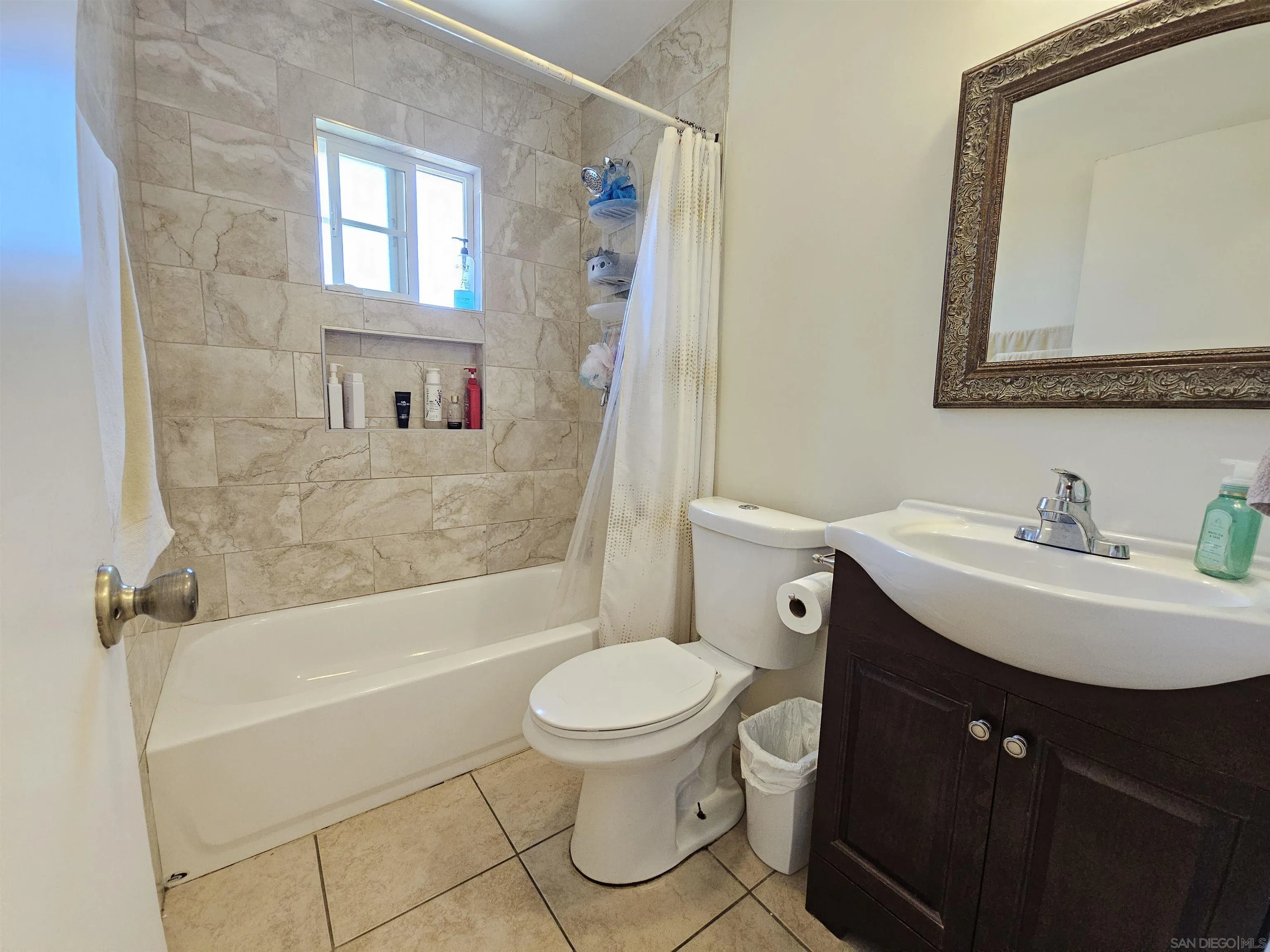 1621 Jade Avenue Chula Vista, CA 91911 - Photo 13 of 19 a bathroom with a sink toilet and shower