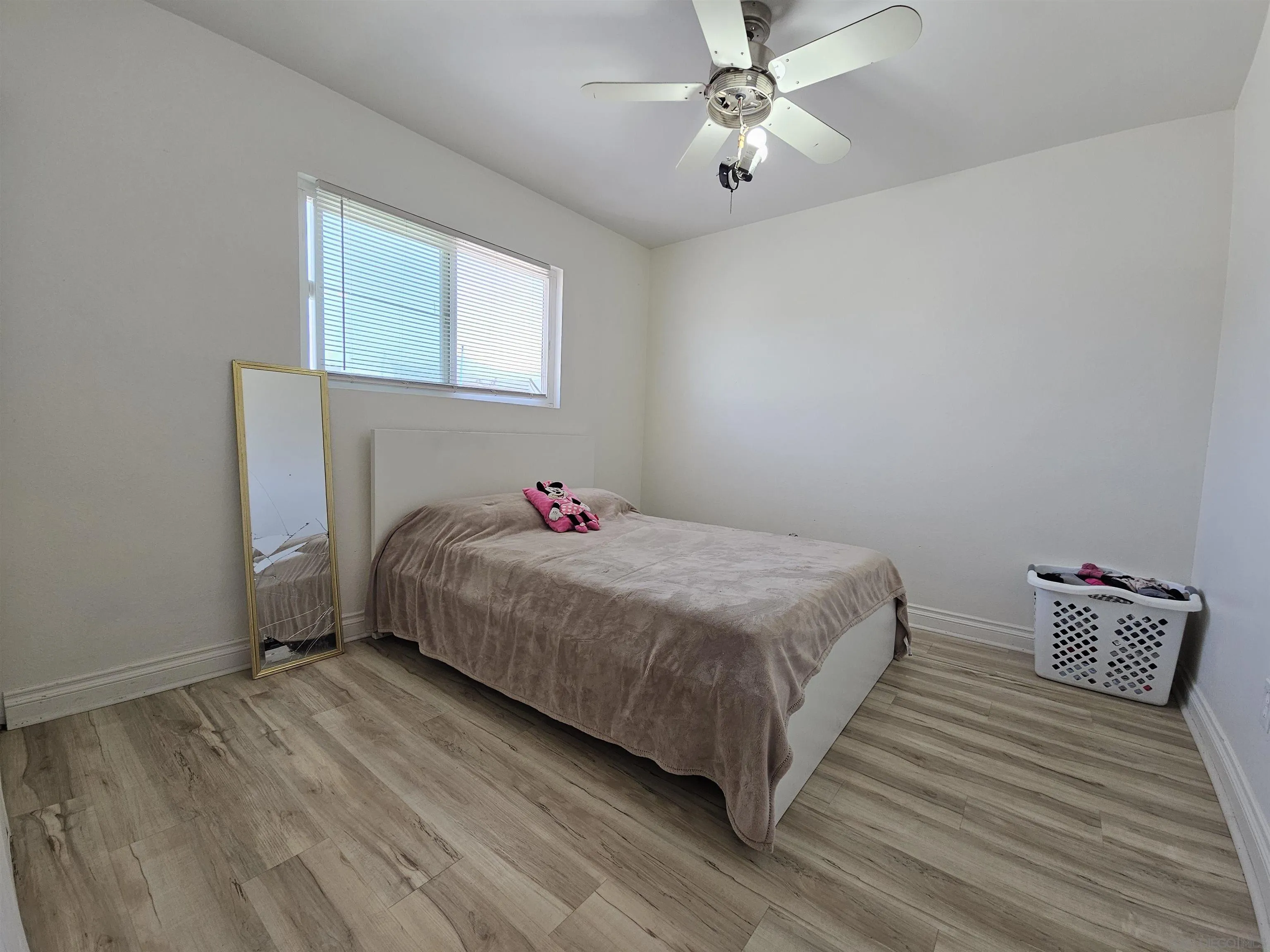 1621 Jade Avenue Chula Vista, CA 91911 - Photo 15 of 19 a bedroom with a bed and a window