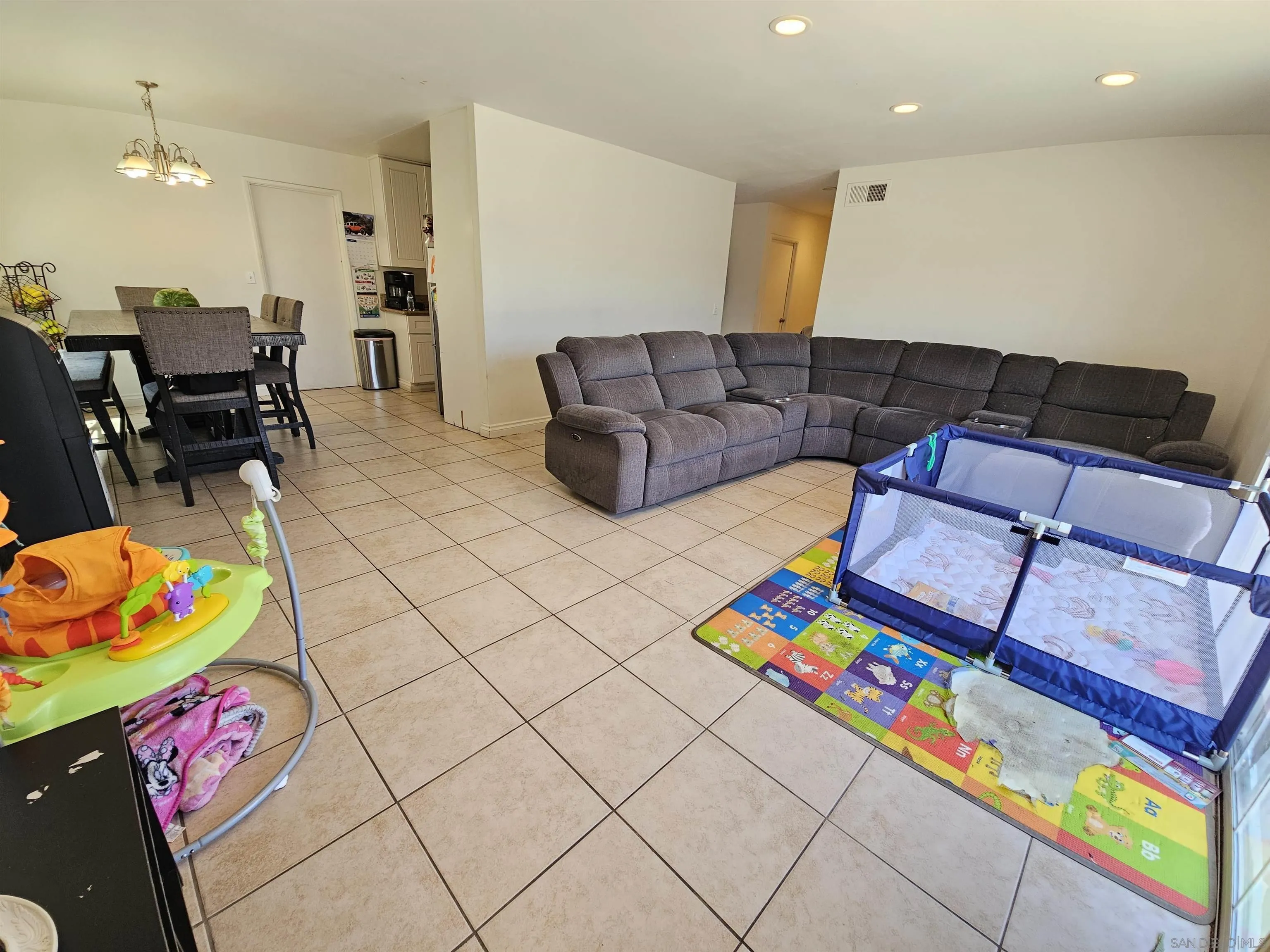 1621 Jade Avenue Chula Vista, CA 91911 - Photo 4 of 19 a living room with furniture and a couch