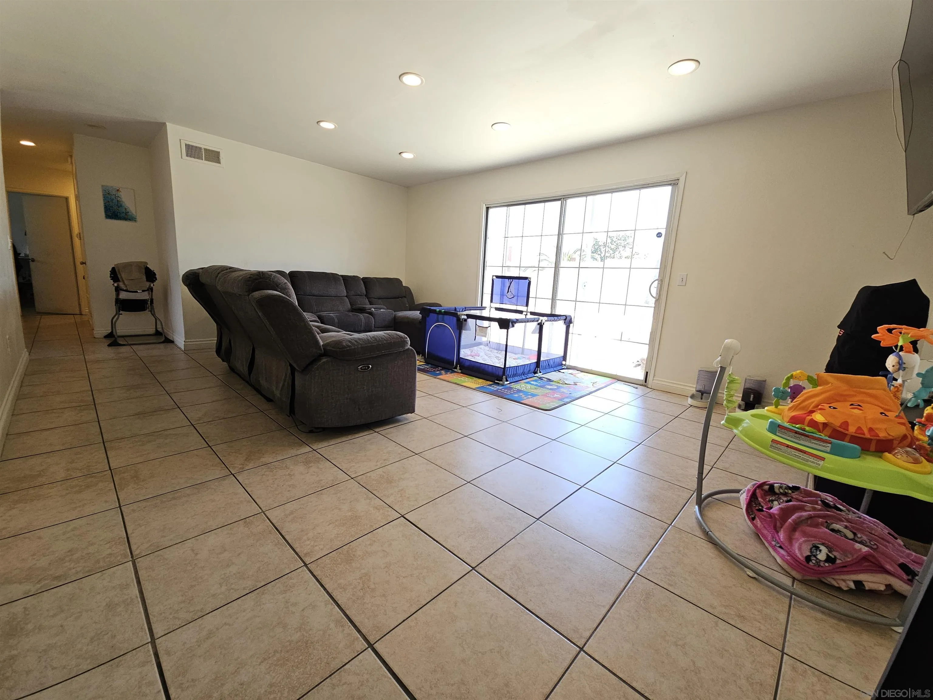 1621 Jade Avenue Chula Vista, CA 91911 - Photo 6 of 19 a living room with furniture and a window