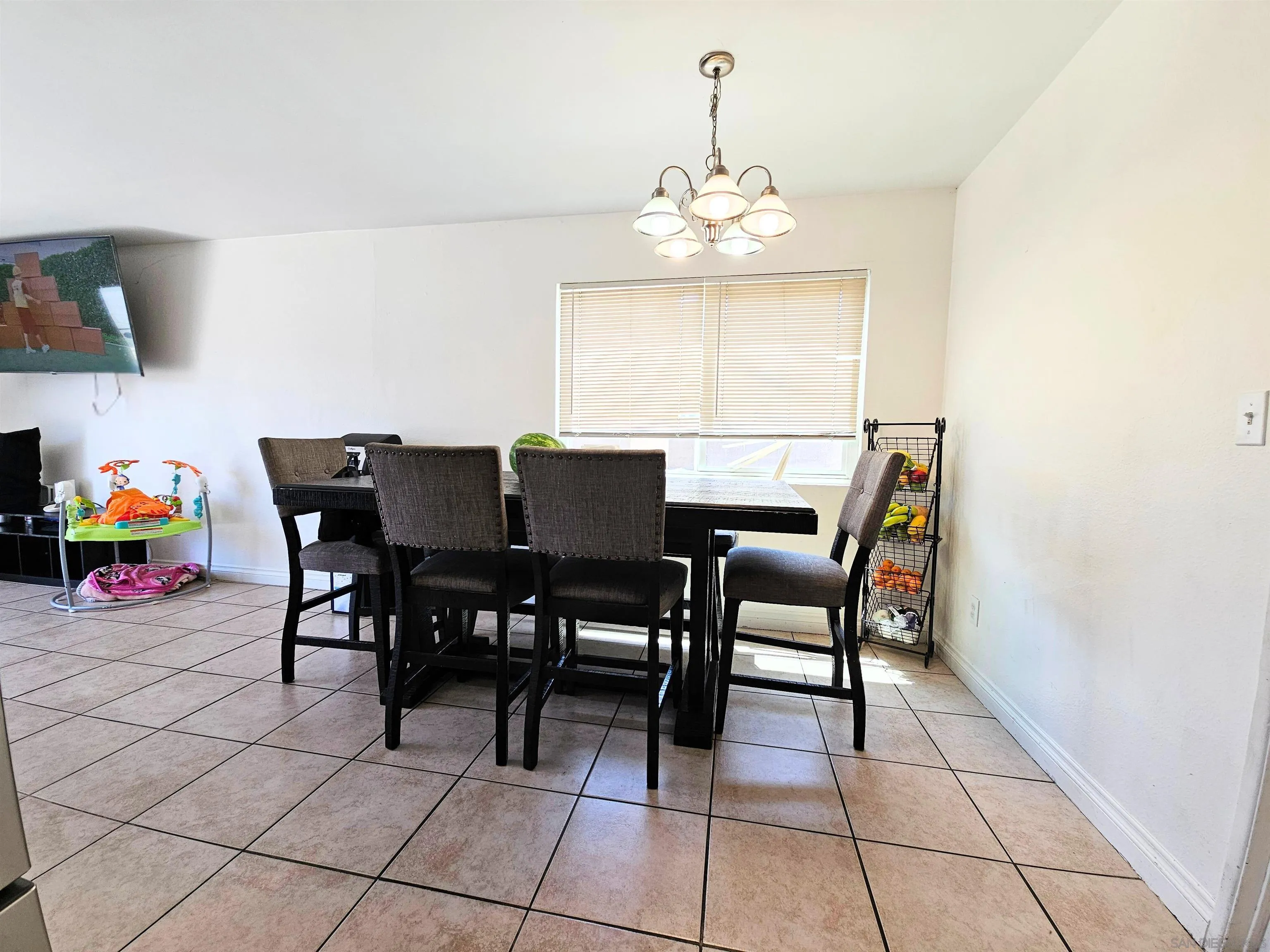 1621 Jade Avenue Chula Vista, CA 91911 - Photo 7 of 19 a view of a dining room with furniture and chandelier