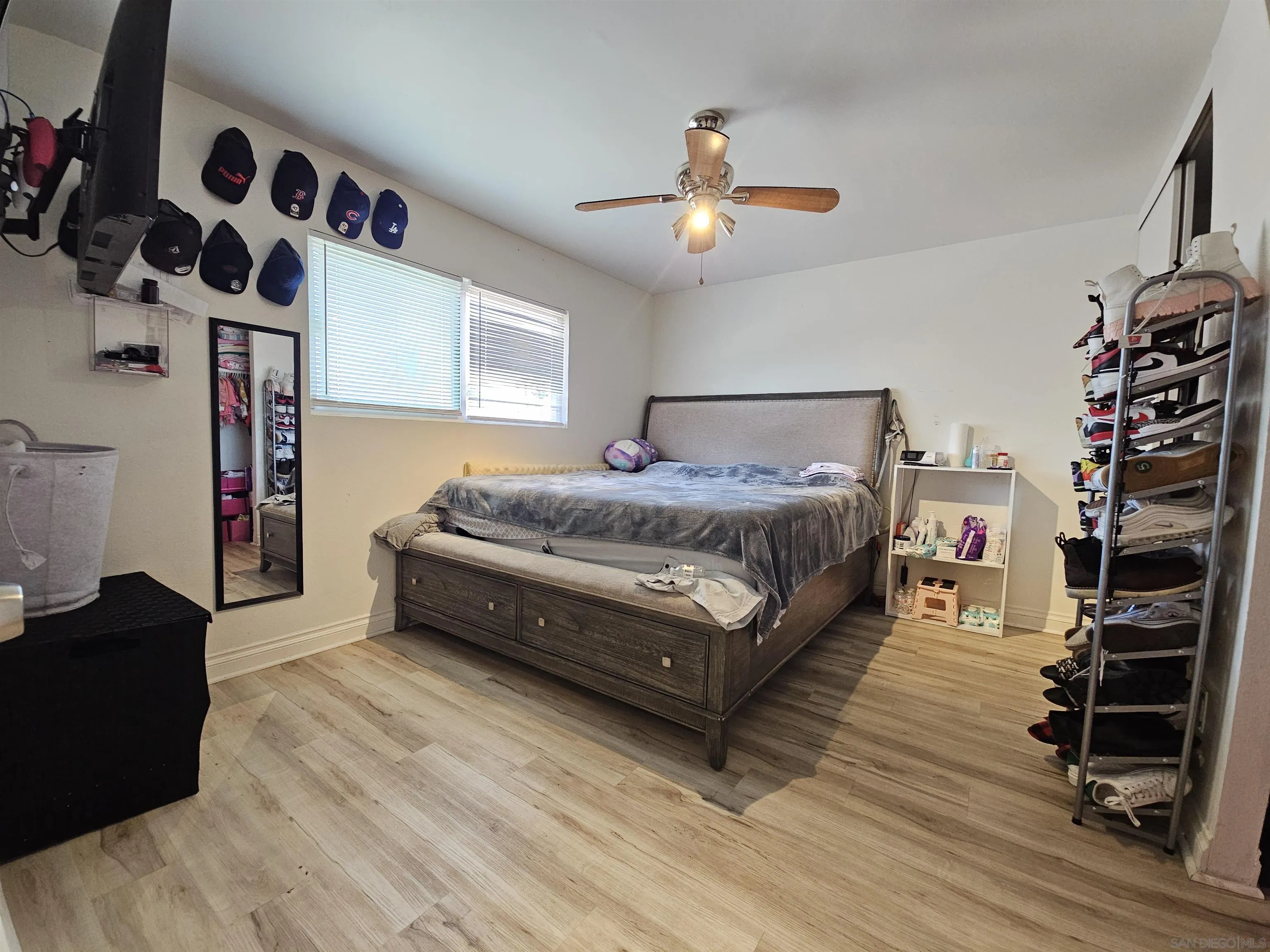 1621 Jade Avenue Chula Vista, CA 91911 - Photo 9 of 19 a living room with a bed furniture and a flat tv screen